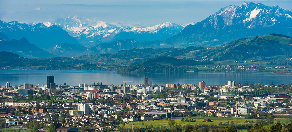 Panoramic view of Zug, Switzerland with Lake Zug and the Swiss Alps